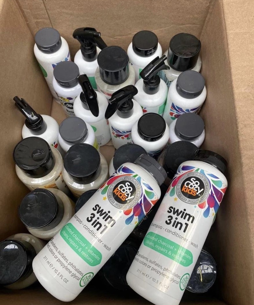 Products Pallets stacked with mixed brand cleaning supplies ready for resale